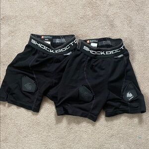 2 pairs of girls hockey pelvic protector shorts.